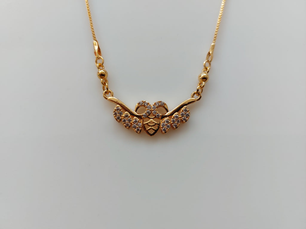 A gold chain necklace with a decorative pendant featuring a central heart and three curved branches adorned with small clear stones, shown on a plain light gray background.