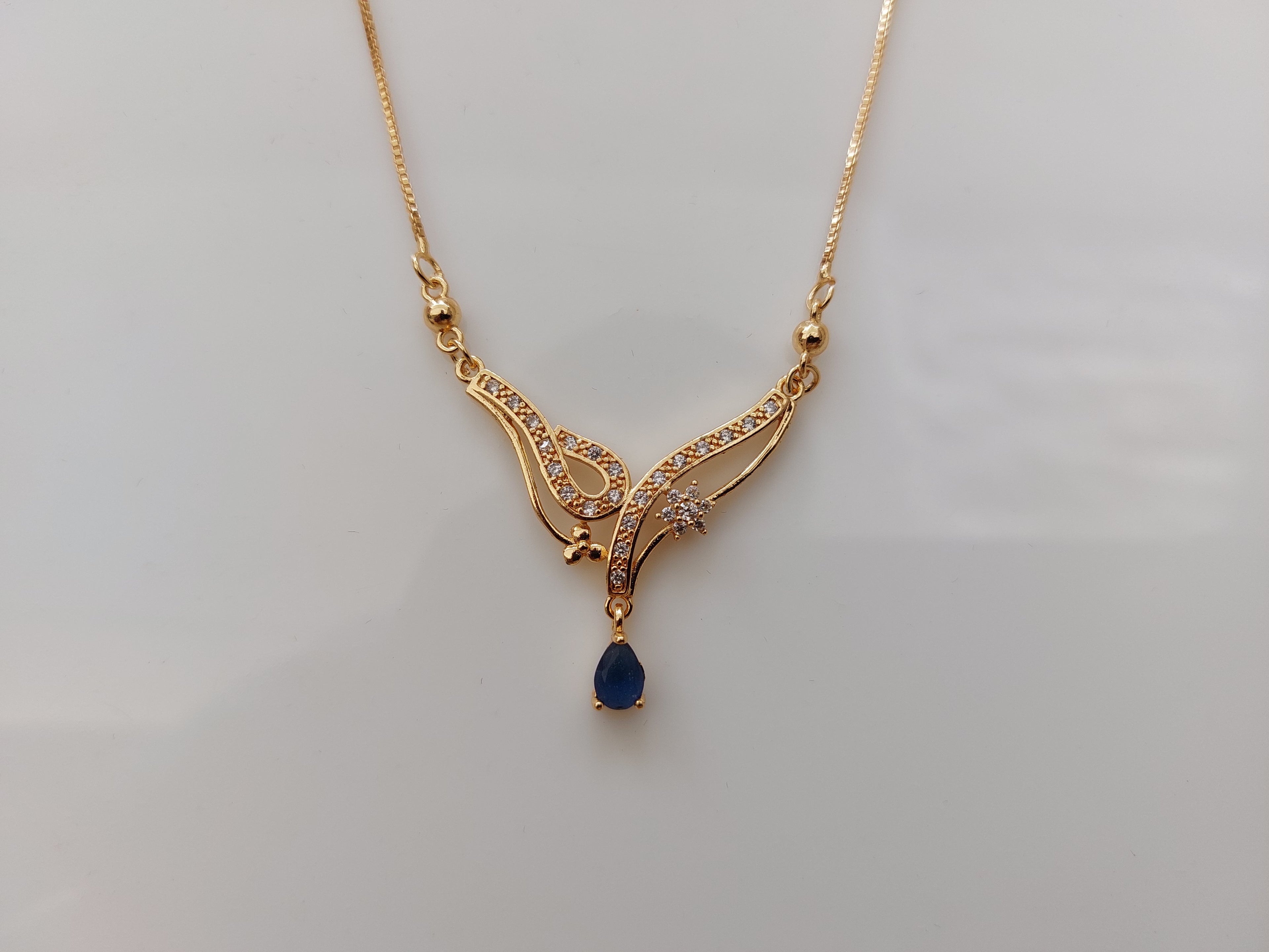 Designer_Rose_Gold_Pendant_with_Navy_blue_drop_AD_stone_A